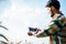 Smart farmer checking barley farm with tablet