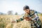 Smart farmer checking barley farm with tablet