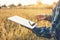 Smart farming Agricultural technology and organic agriculture Woman using the research tablet and studying the development of rice