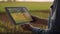 smart farming, futuristic agriculture concept: farmer carrying smart tablet, diagrams, statistics, graphic