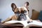 Smart French Bulldog dog with reading glasses and book. Generative AI