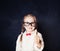 Smart Girl in Glasses with Thumb Up Having Fun on Chalk Board