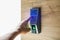 Smart home keyboard password entrance. Human hand pressing the security code combination to unlock the door