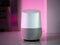 Smart home speaker assistant device in home setting with coloured LED mood lighting - Pink