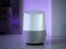 Smart home speaker assistant device in home setting with coloured LED mood lighting - Purple
