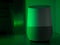 Smart home speaker assistant device in moody coloured LED lighting - Green