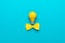 Smart idea with yellow bulb, bow tie on turquoise blue background and copy space