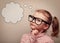 Smart kid in glasses thinking with speech bubble above. Vintage