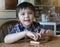 Smart kid playing puzzle toy in Hexagon box, Happy child boy playing wooden block while waiting for food, Concept for developing