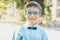 Smart little schoolboy in glasses in shirt and butterfly