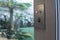 A smart lock with manual switch installed on a sliding door going to the backyard of a upscale home. Currently locked.