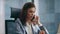 Smart manager consulting phone sitting office close up. Business lady calling