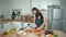 Smart mother and asian girl cooking together and chopping vegetable. Pedagogy.