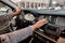 Smart parking. Cropped photo of a woman using parking assist system while driving a car