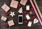 Smart phone with christmas presents on wooden background top view. Online holiday shopping concept. Flat lay, text space. Internet