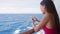 Smart phone close up - woman using smartphone app on cruise ship vacation travel