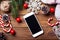 Smart phone mock up with rustic Christmas decorations.