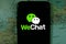 Smart phone with the WeChat logo.  WeChat is a mobile text messaging service and voice message