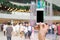 Smart phone with white screen in hand on blurred in shopping mall background,shopping online concept,shopping by smart phone