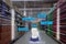 Smart retail concept, robot service use for check the data of or Stores that stock goods on shelves with easily-viewed barcode and