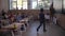 Smart schoolboy going to blackboard during lesson