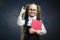 Smart Schoolgirl Hold Book Point Index Finger up