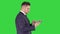 Smart senior businessman using a technology tablet on a Green Screen, Chroma Key.