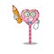 A smart Student candy heart lollipop character holding pencil