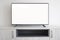 Smart Tv on light gray cabinet with white blank screen.  Mockup TV concept.