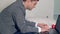 Smart young man in a suit working on a computer