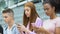 Smartphone addicted teens using gadgets outdoor, lack of real communication