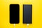 Smartphone charging with power Bank via USB cable on yellow background top view