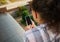 Smartphone with copy ad space on blank screen in the hands of a woman on balcony