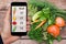 Smartphone with information on the amount of calories in vegetables.