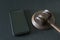 Smartphone and judges gavel on black background. Crime. Template. Mockup