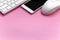 Smartphone,keyboard,mouse on blank pink background