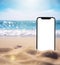 The smartphone lies buried in the sand on the beach, and takes a photo of the beach in the background. can be used mock up for