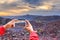 Smartphone photographing top view monastery at Larung gar Buddhist Academy in sunset time, Sichuan, China