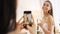 Smartphone photography of bride with champagne glass for wedding celebration to post on social media app. Smile portrait