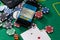 Smartphone with poket table on screen, playing cards and chip cards on poker table. Online casino.