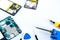 Smartphone`s motherboard and tools lay on the white table, concept of mobile phone, electronic, repairing, upgrade technology