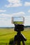 Smartphone on tripod capturing summer landscape