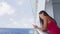 Smartphone woman texting on social media app on cruise ship travel vacation