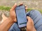 Smartphone in a young man\'s hand and a WhatsApp conversation. Chat technology WhatsApp. Communication and social networks.