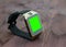 Smartwatch isolated on wood background with chroma key green screen
