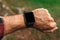 Smartwatch on male hiker hand, blank mock up screen