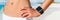 Smartwatch woman wearing watch banner. Panorama crop closeup arm and stomach of person ready to run or train on summer
