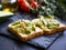 Smashed avocado on toast, tasty healthy appetizers with cherry t