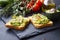 Smashed avocado on toast, tasty healthy appetizers with cherry t