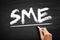 SME Small And Medium-sized Enterprises - businesses whose personnel numbers fall below certain limits, acronym text on blackboard